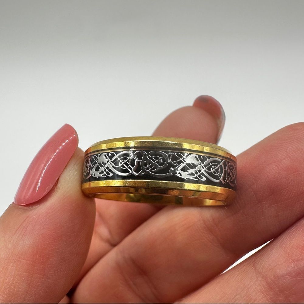 Men's size 12.5 yellow gold tone with black center/silver scroll work, ring!